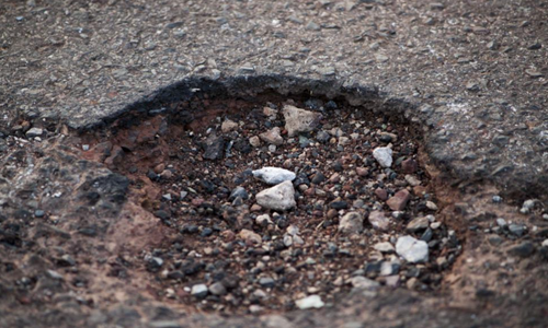 Hole-in-asphalt-from-Freerange.png